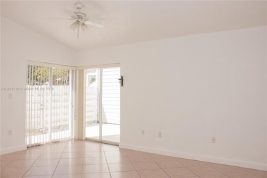 Spacious living area with two sliding glass doors 