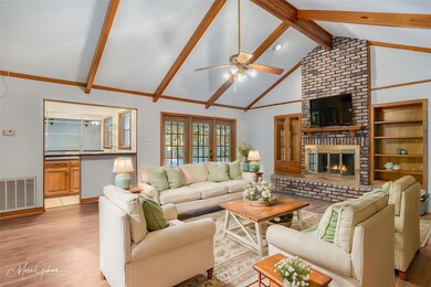Living room with ceiling fan, vaulted ceiling, lar