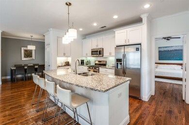 Beautiful kitchen with large island and pendant li