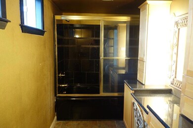 Large bathroom with a built in vanity and a nice a