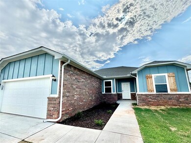 Ranch-style home with a garage and a front lawn