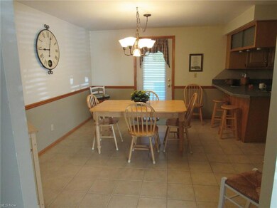 Eat in Kitchen with light tile flooring