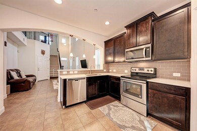 Kitchen with stainless steel appliances, arched w