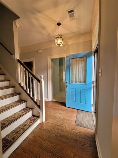 The foyer features fresh paint and smooth ceilings