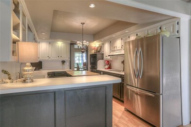 This view of the kitchen reveals the serving bar a