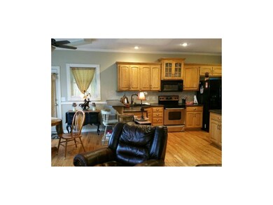 Open kitchen with large eat-in area boasts a break