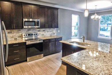 Kitchen Area / View into Dining Area