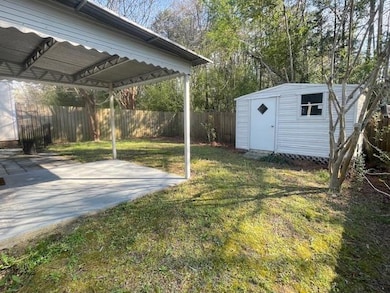 BACKYARD WITH WIRED STORAGE SHED
