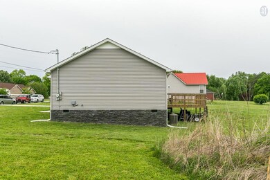SIDE VIEW OF HOME FROM LOT INCLUDED IN SALE