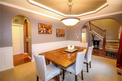 Second view of the picturesque formal dining room, with the unique tray ceiling.  