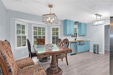 Dining room featuring baseboards, an inviting chan