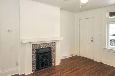 Living room with decorative fireplace and newer la