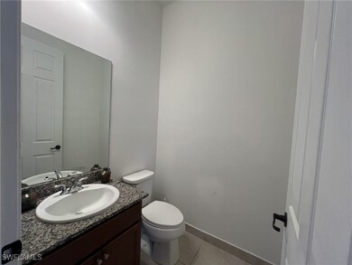 Bathroom featuring vanity and tile patterned floors