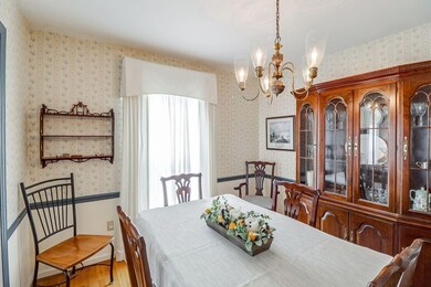 The dining room is grand, complete with chair rail