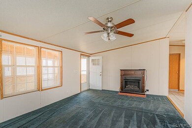 Unfurnished living room featuring a textured ceili