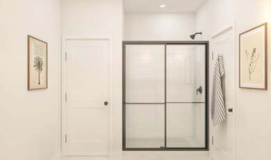 Primary bath with glass shower enclosure