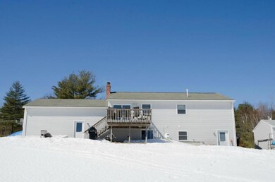 Back view of home with deck