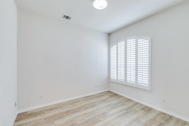 Study featuring light hardwood / wood-style flooring