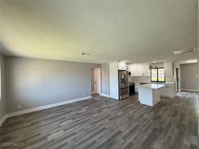 Kitchen featuring stainless steel refrigerator wit