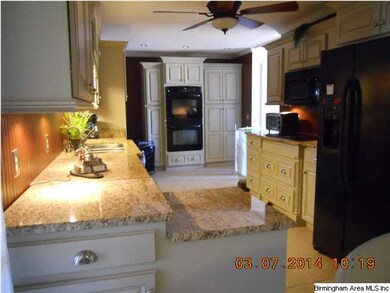 Wonderful kitchen with custom cabinets and granite