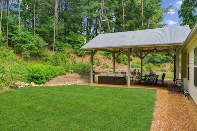 Sprawling, Fenced Yard -.56 private acres with room to roam, play, or garden.