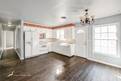 View into the hallway leading to bedrooms and bath