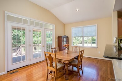 A bright morning room with triple glass doors with