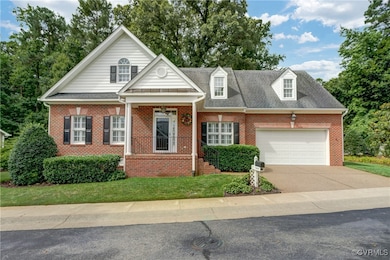 View of front of property with concrete driveway,