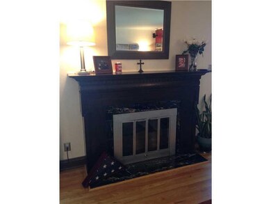 Living Room. A  CLOSER VIEW OF THE FIREPLACE WITH 