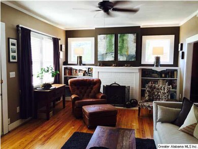 Living room is very spacious and features fireplac