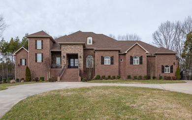 This gorgeous, custom built home offers over 5,000 sq ft of living space on over an acre, featuring a park like setting, a circular drive and your own private, gated entrance to the 3 car garage. 