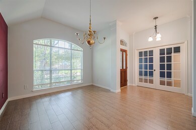Bright and elegant room with large windows, a chan