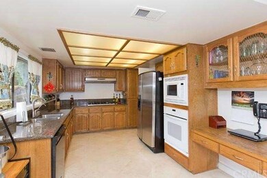 Kitchen overlooks backyard