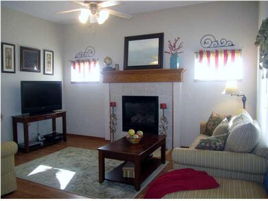 Living Room with 10 ft ceilings, wood laminate flo