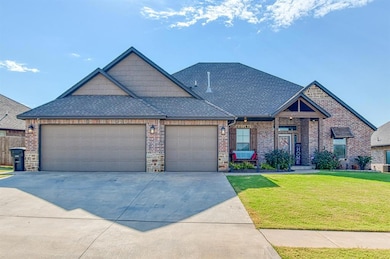 View of front of home with a shingled roof, a front lawn, concrete driveway, and a garage