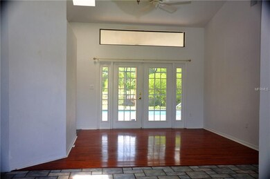 View from foyer into formal living room with ceili