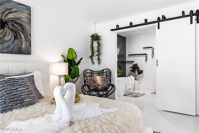 Bedroom featuring a barn door