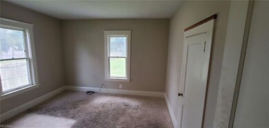 Unfurnished room featuring carpet floors