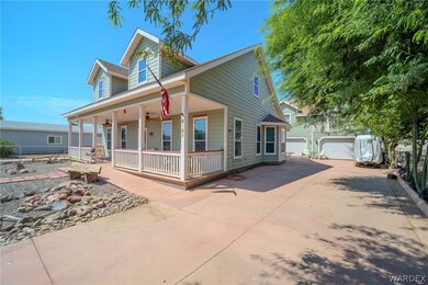View of front of home with a garage, covered porch