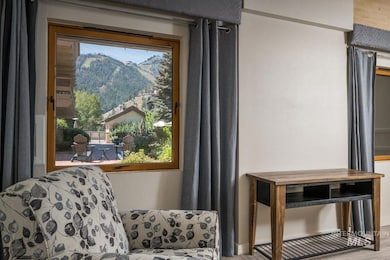 Living area featuring a mountain view and wood finished floors