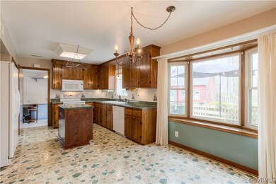 Kitchen with island and bay window includes immaculate 