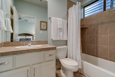 The 1st floor ensuite guest bath features neutral