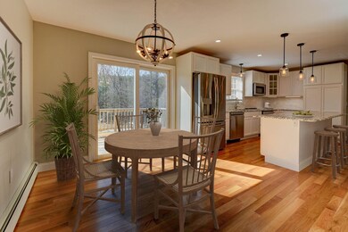 Enjoy breakfast in the dining area or on the deck. Photo virtually staged.