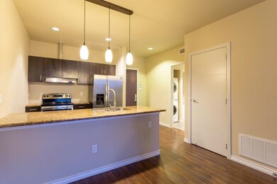 Kitchen with sink, dark hardwood / wood-style floo