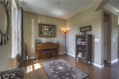 This office space is very versatile!  It can also be used as a playroom, or a formal living room!