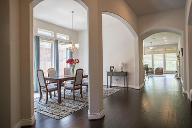 Welcome home! Grand entry way with soaring 12  ceilings. Beautiful arches throughout.