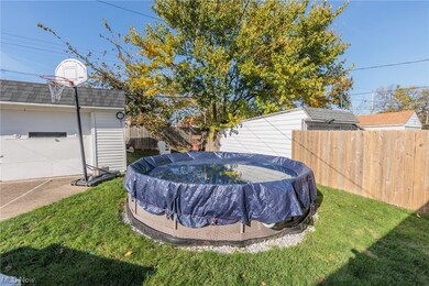 View of yard featuring a covered pool, pool stays.