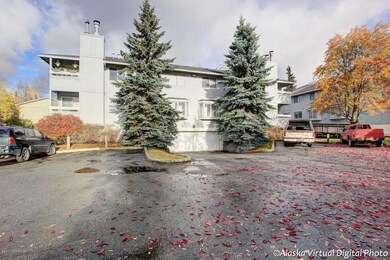 Condo on left with the flowers