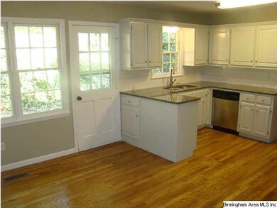 Eat-in kitchen with new granite countertops.