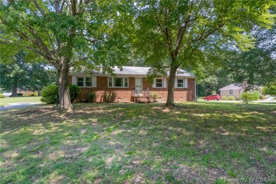 Ranch-style home with a front yard